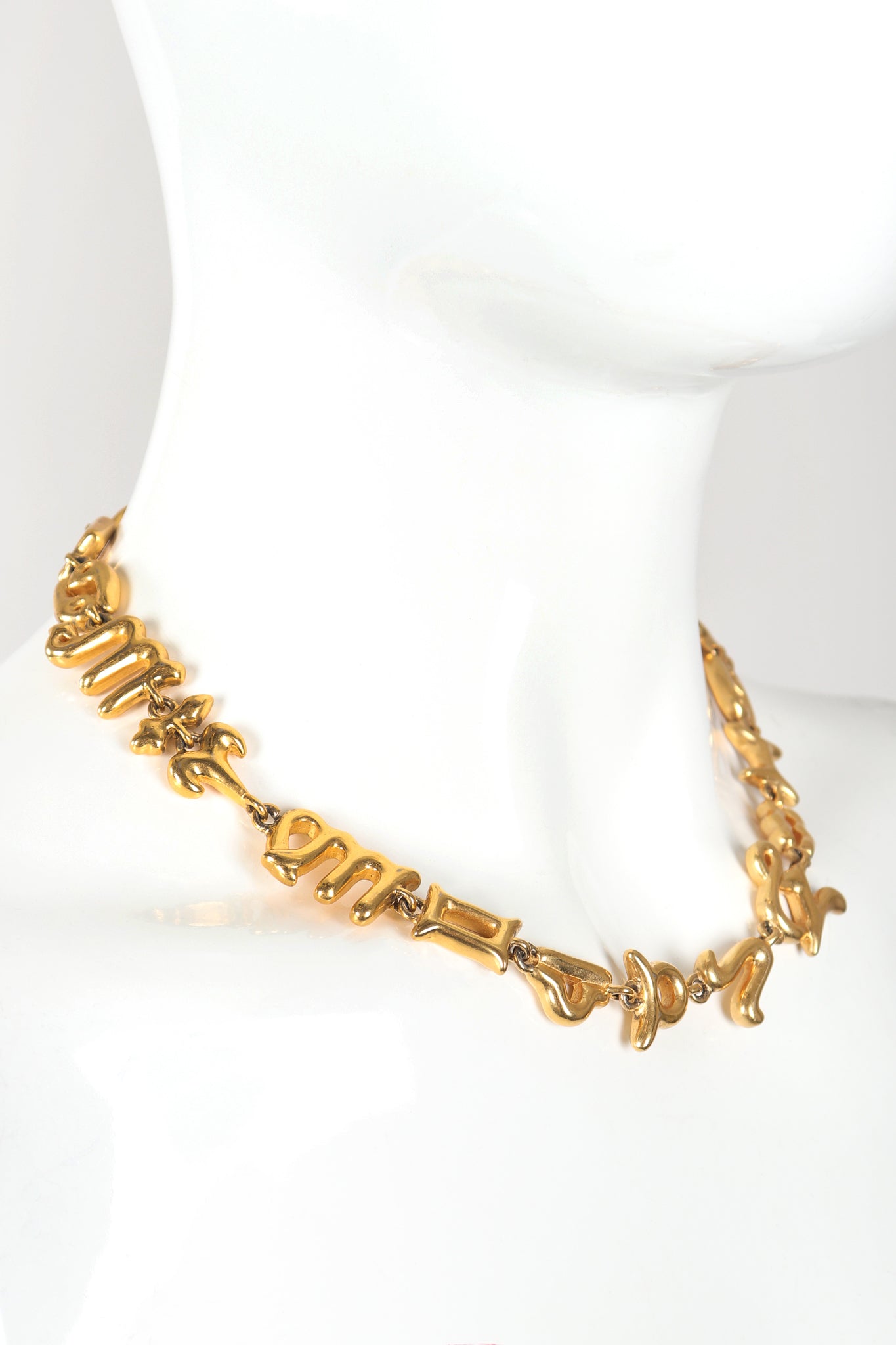 Recess Vintage Fendi Gold Astrology Symbol Necklace on Mannequin