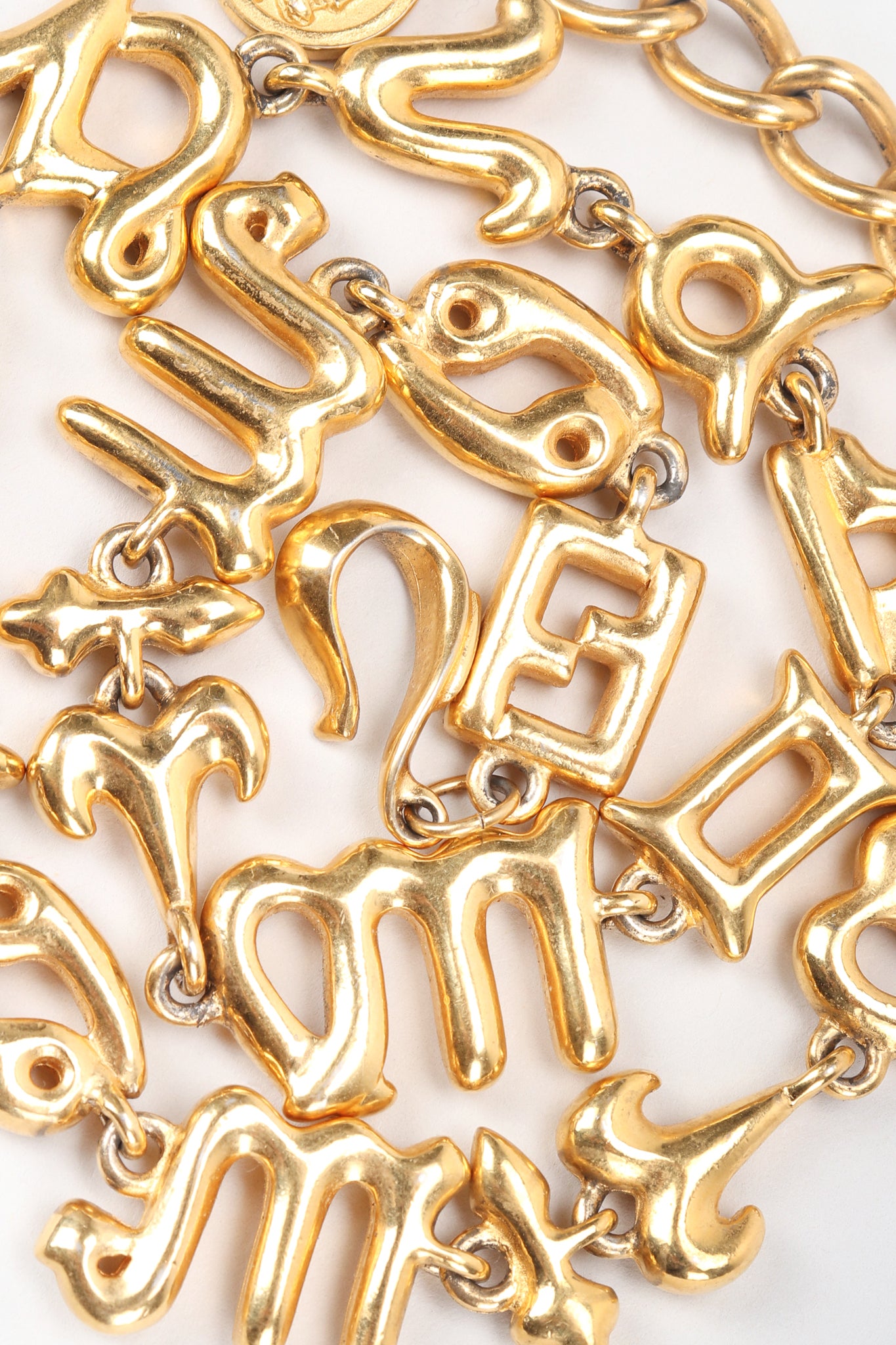 Recess Vintage Fendi Gold Astrology Symbol Collar Necklace Jumbled on White Background