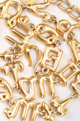 Recess Vintage Fendi Gold Astrology Symbol Collar Necklace Jumbled on White Background