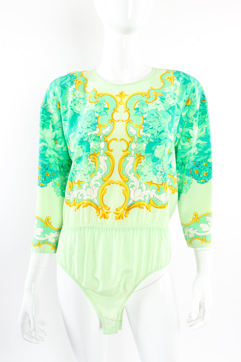 Bodysuit-style blouse with pearl strand print and flower