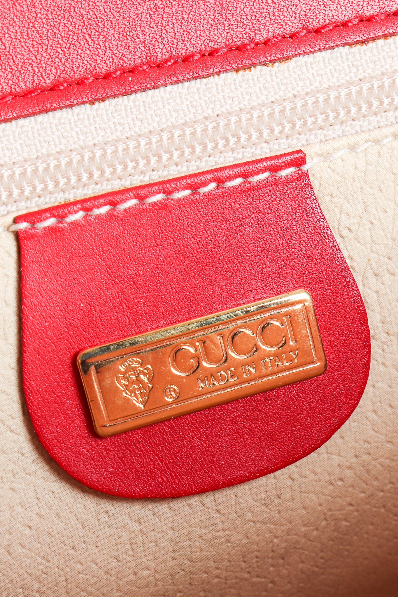Vintage Gucci Red Flora Convertible Clutch metal signature tag at Recess Los Angeles