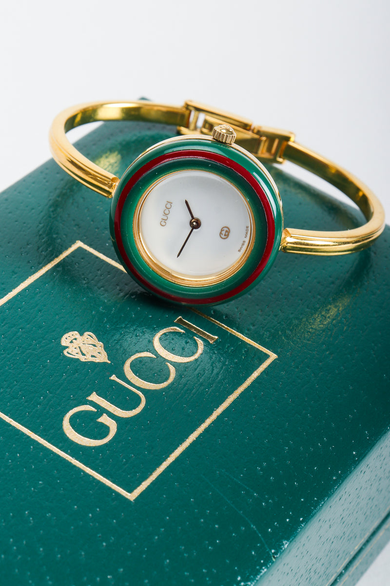 Vintage Gucci 1952 Boxed Bracelet Watch on top of green Gucci box