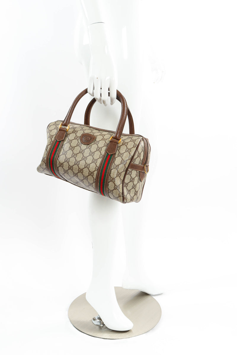 Vintage Gucci GG Monogram Mini Duffle Bag on mannequin hand @ Recess LA