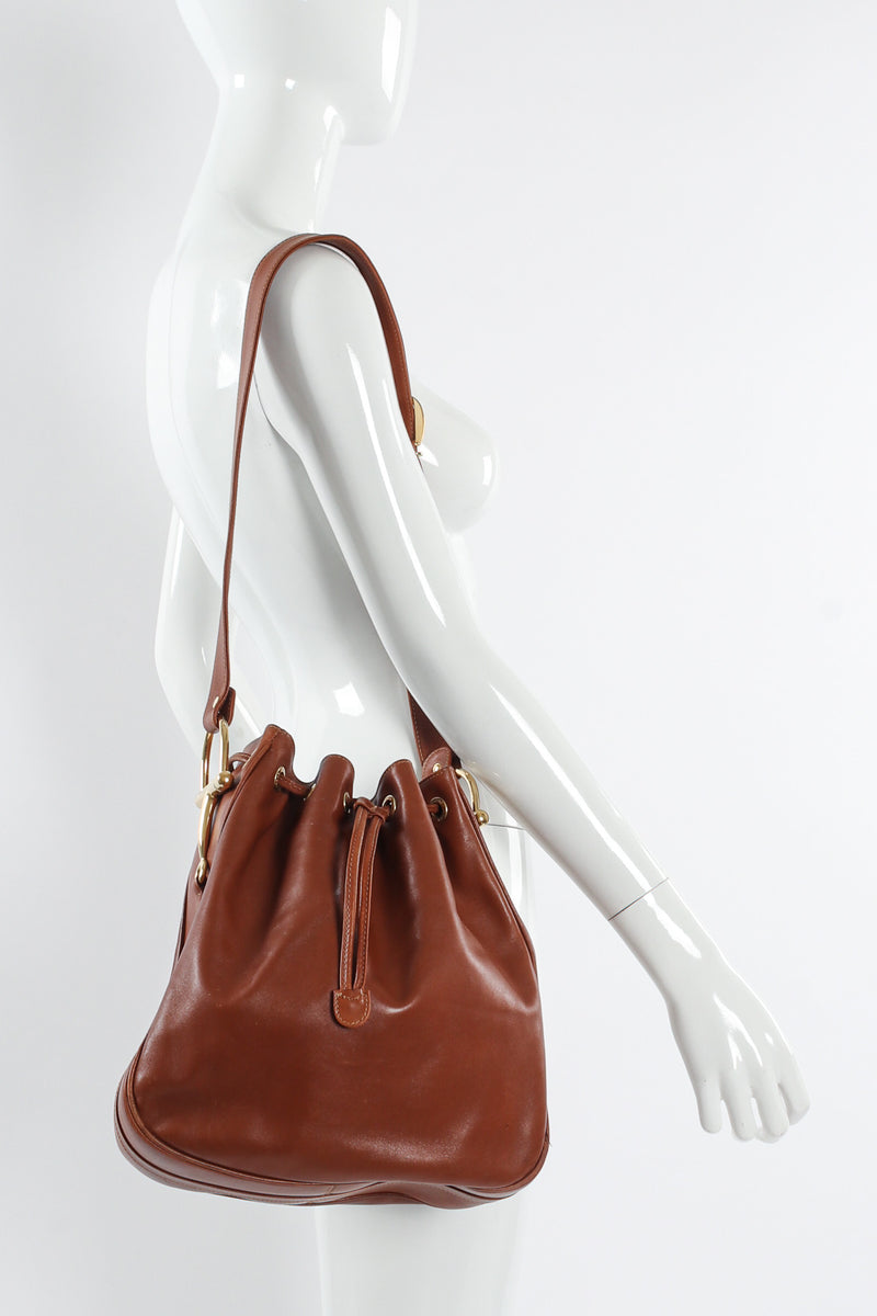 Vintage Gucci Drawstring Leather Bucket Bag on mannequin shoulder  @ Recess LA