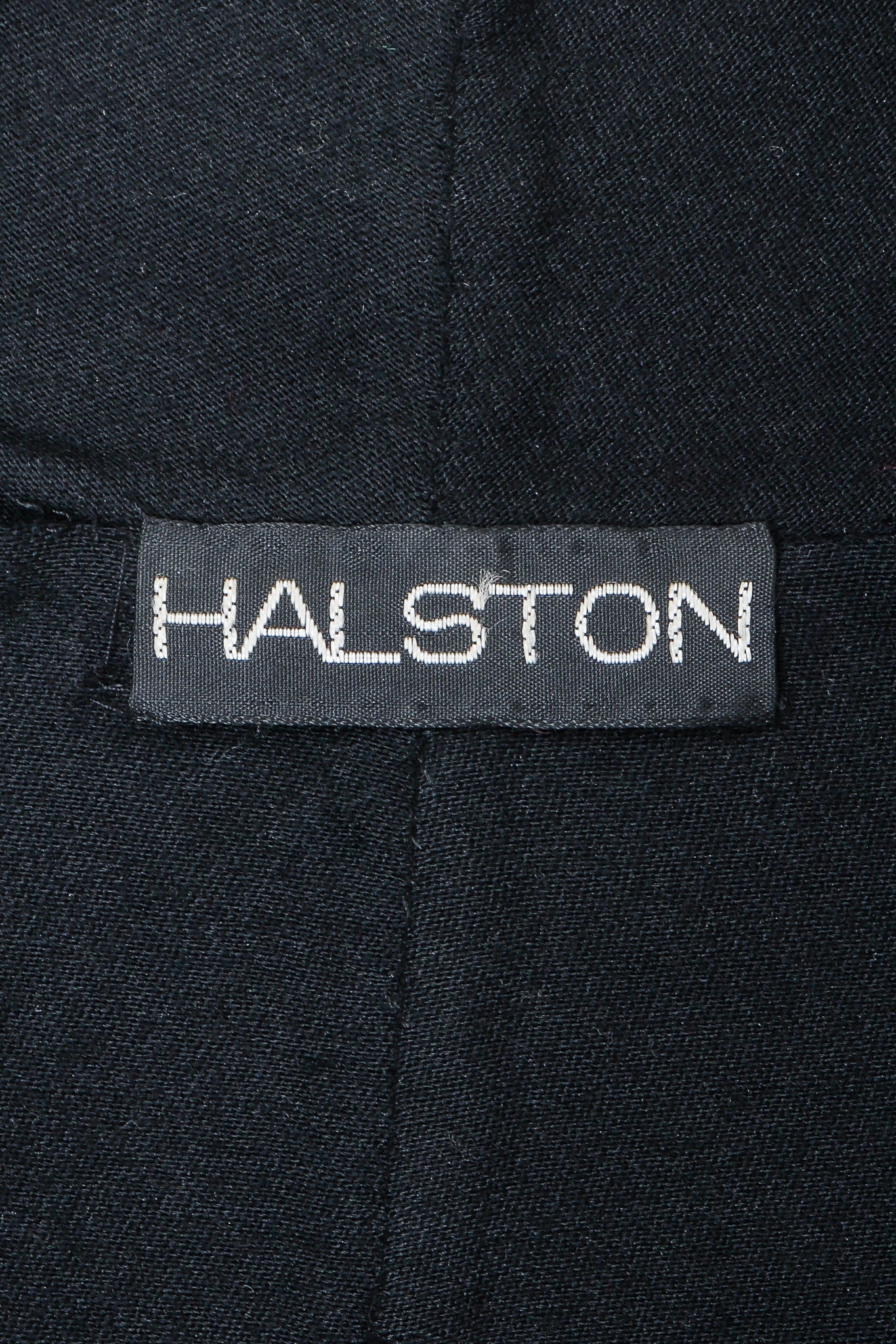 Vintage Halston label on black fabric