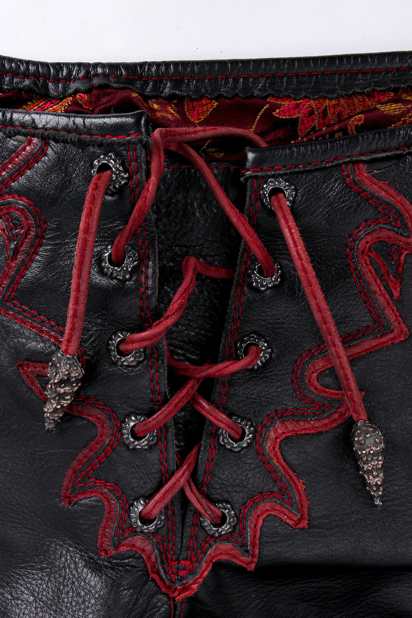 Artisanal Handmade Flame Lace Up Leather Pant lace/charm close up @ Recess LA