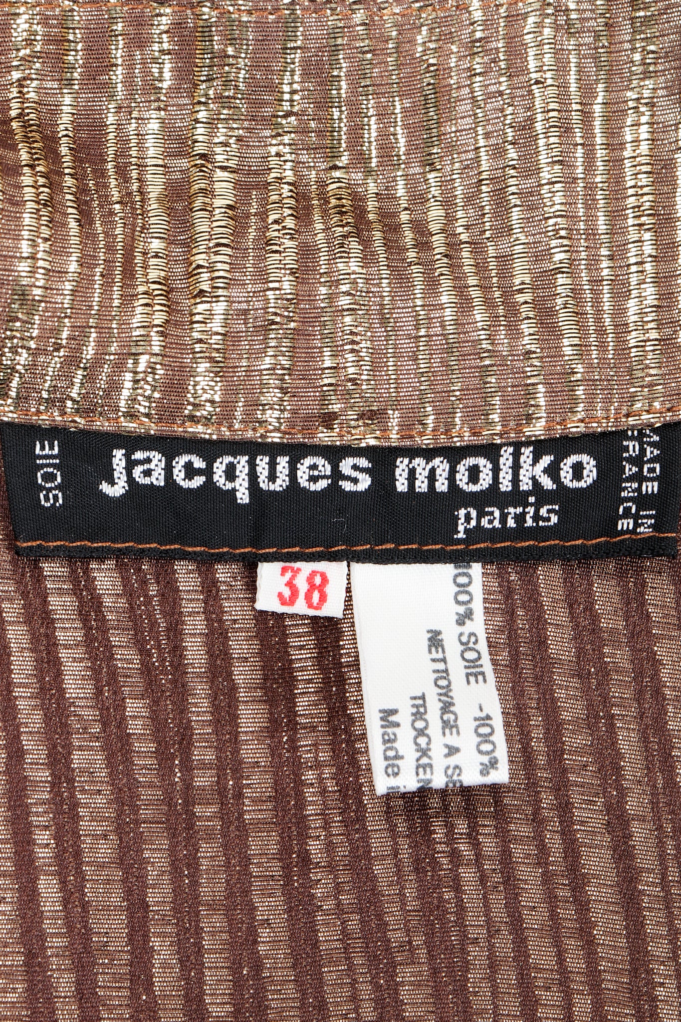 Vintage Jacques Molko label on gold