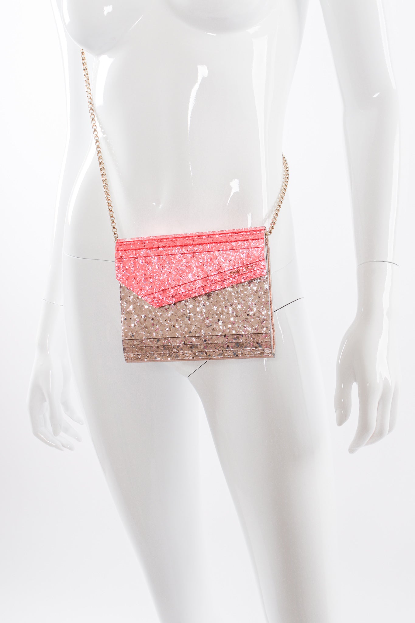 Jimmy Choo Two-Tone Acrylic Glitter Clutch Bag on mannequin at Recess Los Angeles