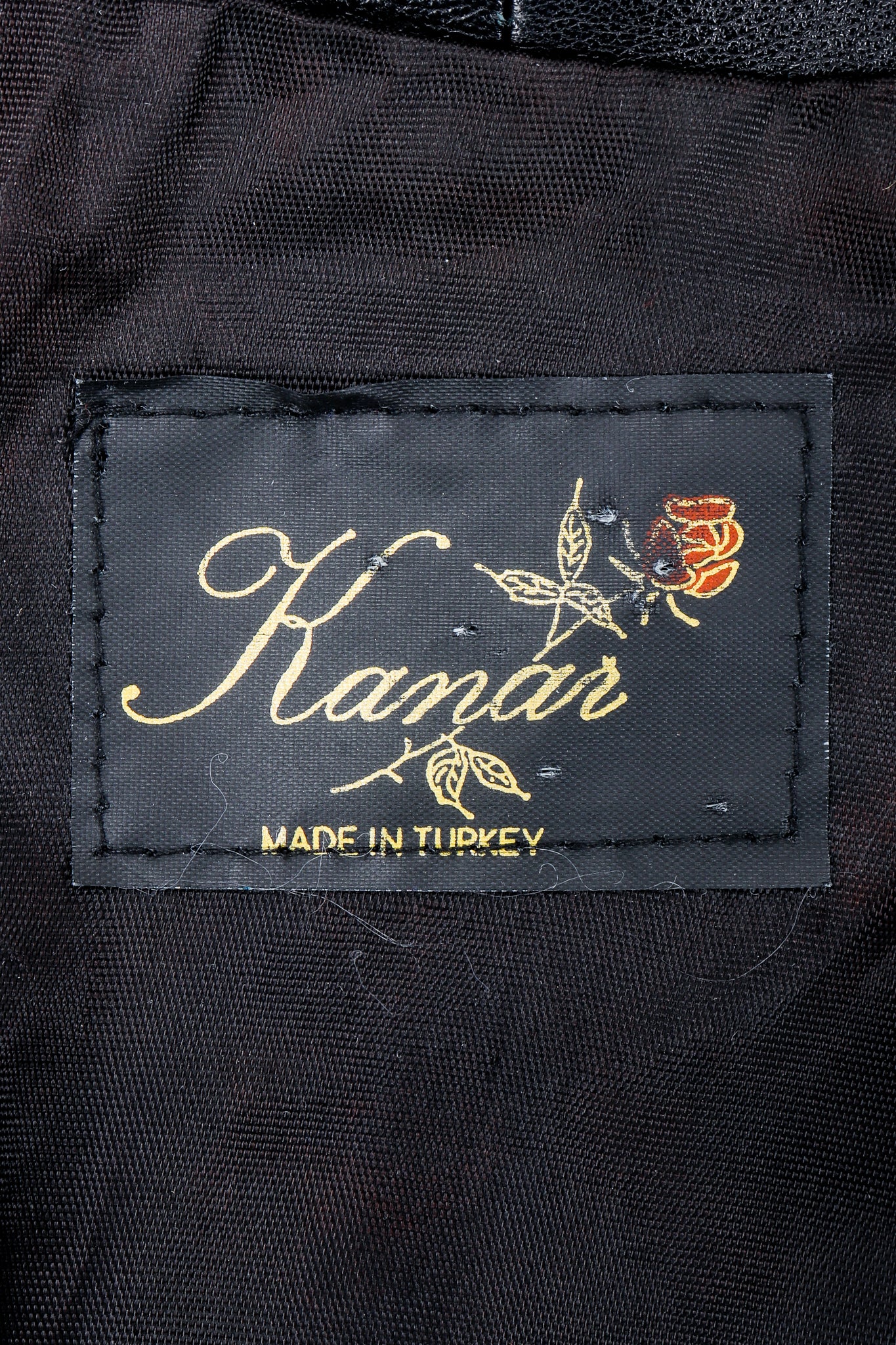 Vintage Kanar Label on black fabric