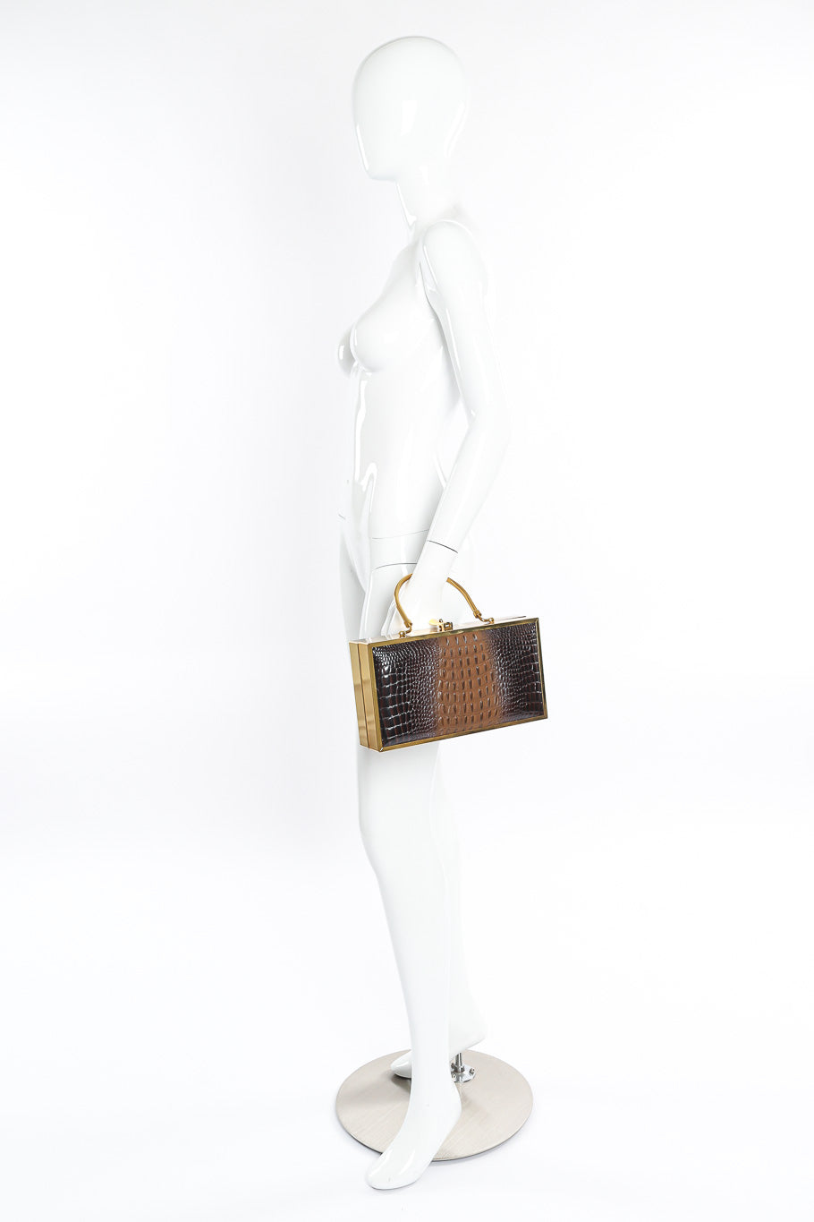 Lou Taylor gold frame box purse on mannequin @recessla