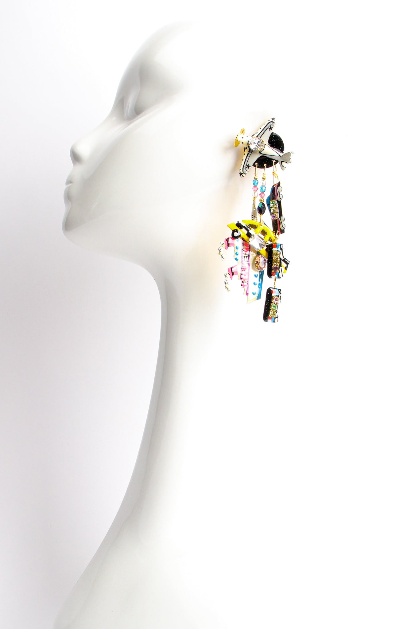 Vintage Lunch At The Ritz Weekend Getaway Travel Charm Earrings on mannequin at Recess Los Angeles