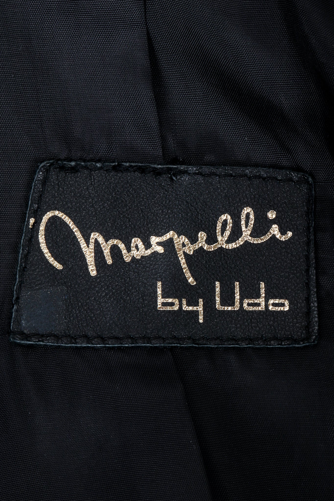 Vintage Marpelli by Udo label on black fabric