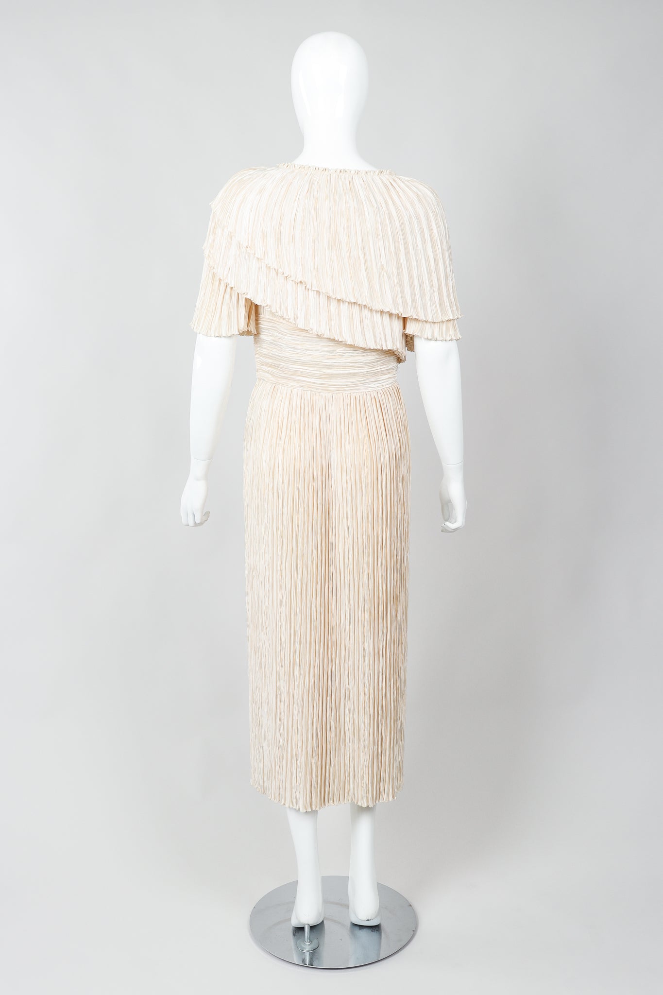 Vintage Mary McFadden Cream Pleated Asymmetrical Draped Collar Dress on Mannequin back at Recess