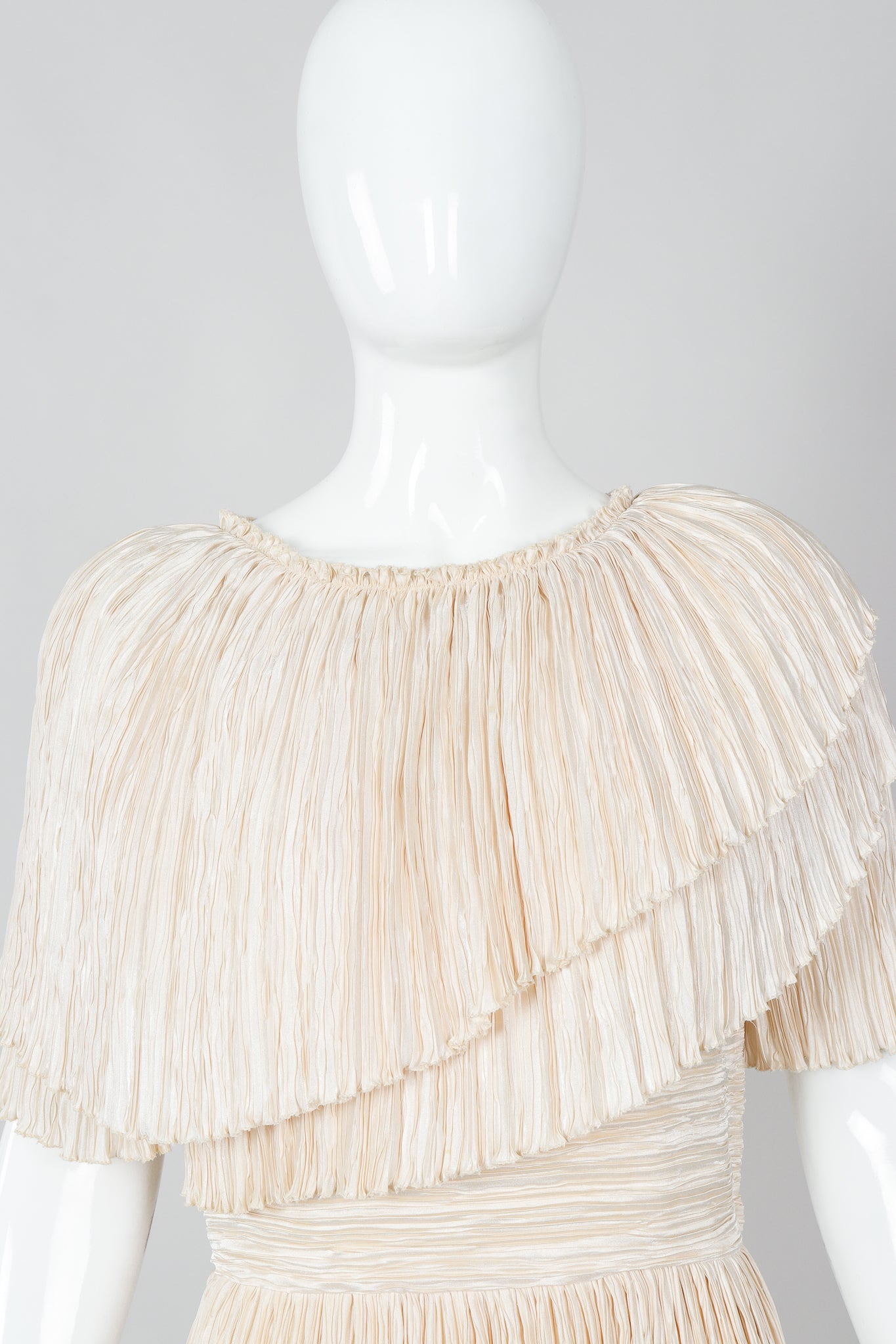 Vintage Mary McFadden Cream Pleated Asymmetrical Draped Collar Dress on Mannequin Neck at Recess