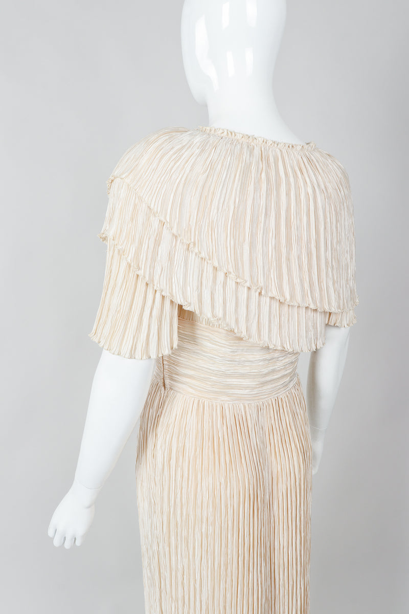 Vintage Mary McFadden Cream Pleated Asymmetrical Draped Collar Dress on Mannequin angled at Recess