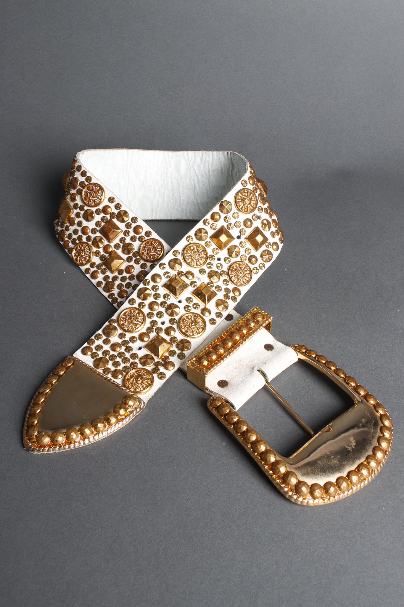 Studded leather belt with assorted gold studs by Michael Morrison flat lay @recessla