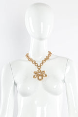 Vintage Monet Floral Knot Pendant Necklace on mannequin @ Recess Los Angeles