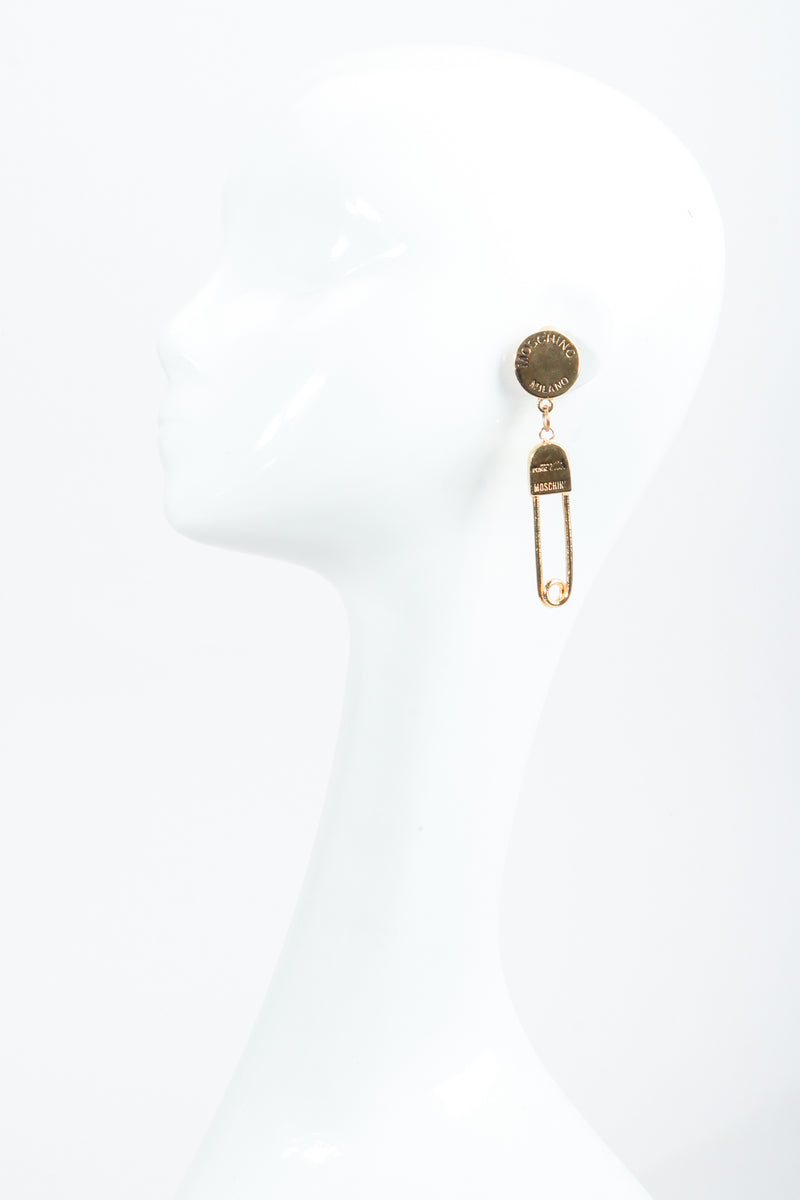 Vintage Moschino I Believe In Punk Chic Safety Pin Earrings on Mannequin at Recess