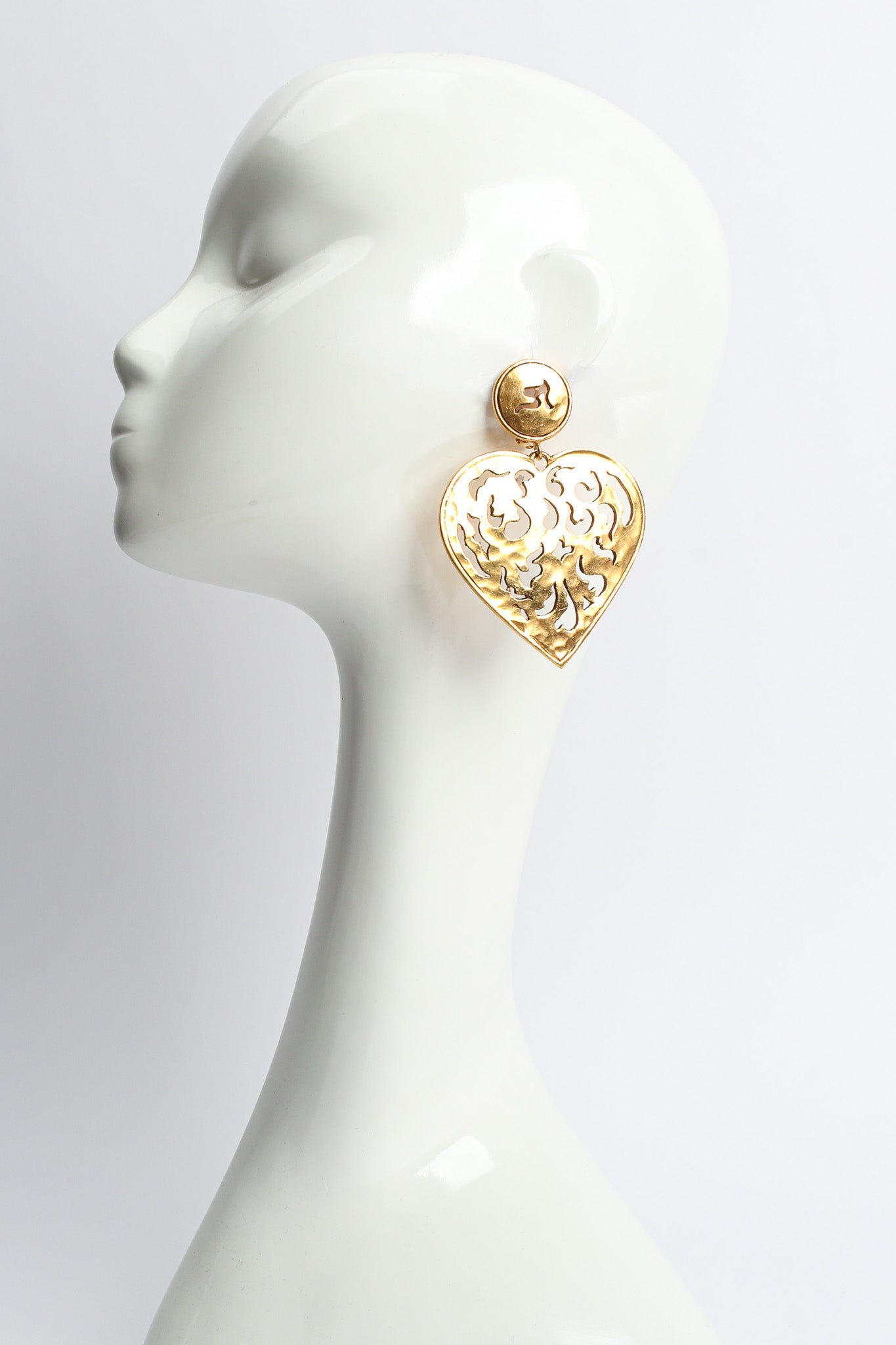 Vintage Flame Filigree Cutout Heart Earrings on mannequin @ Recess LA