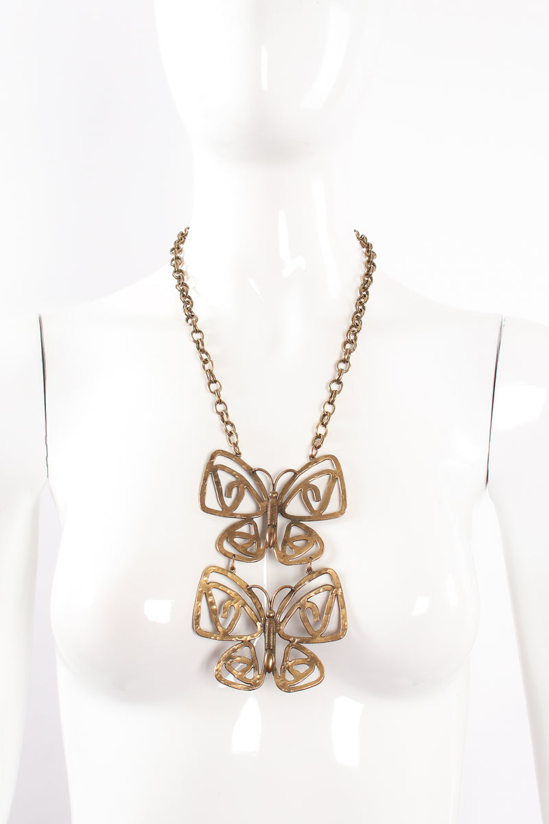 Vintage Brass Double Butterfly Necklace on mannequin at Recess Los Angeles