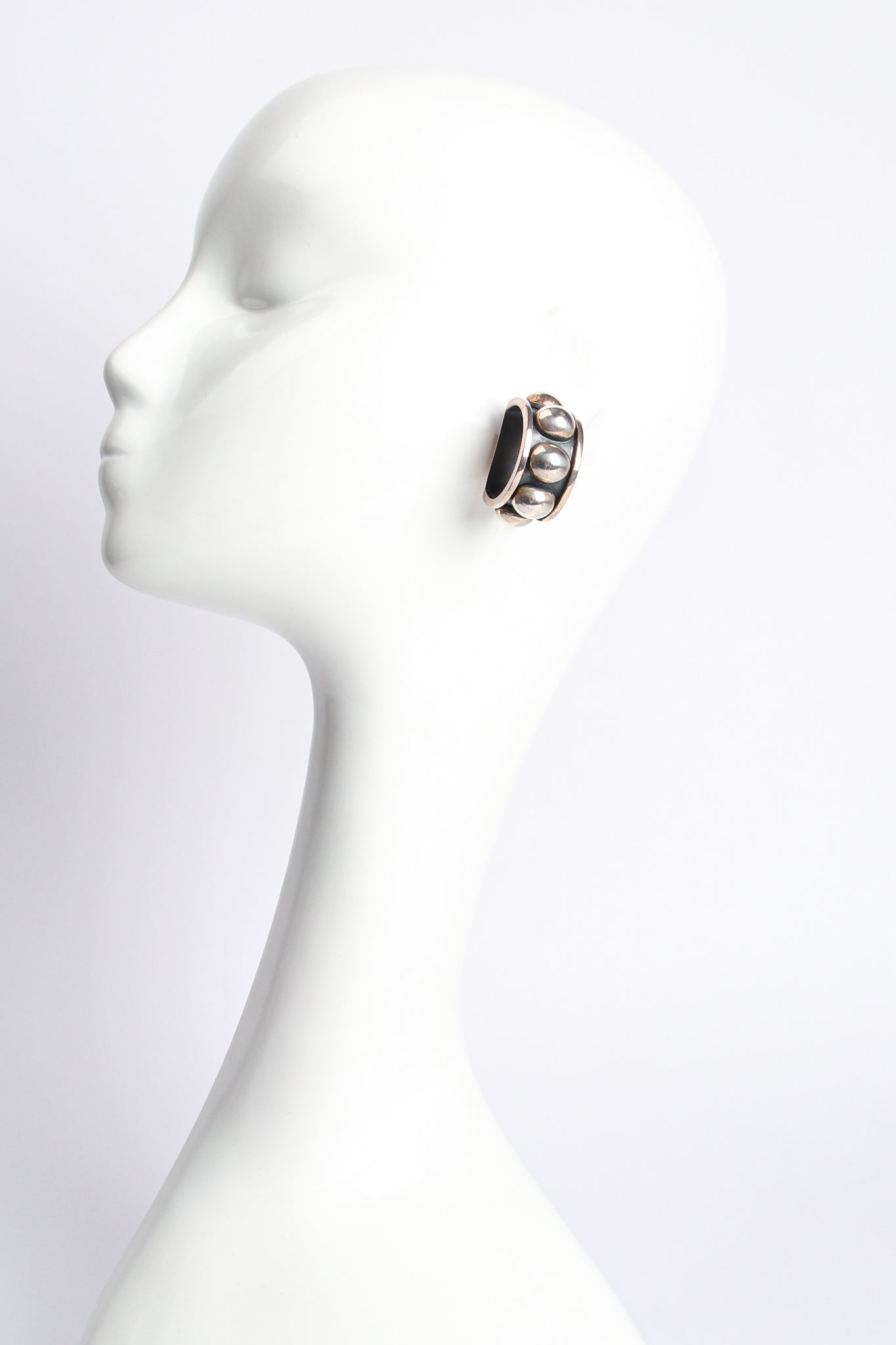 Vintage Sterling Silver Dome Hoop Clip Earrings on mannequin at Recess Los Angeles