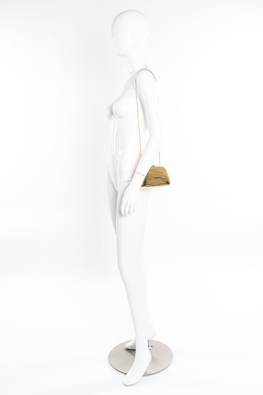Rounded metal clutch bag on mannequin @recessla