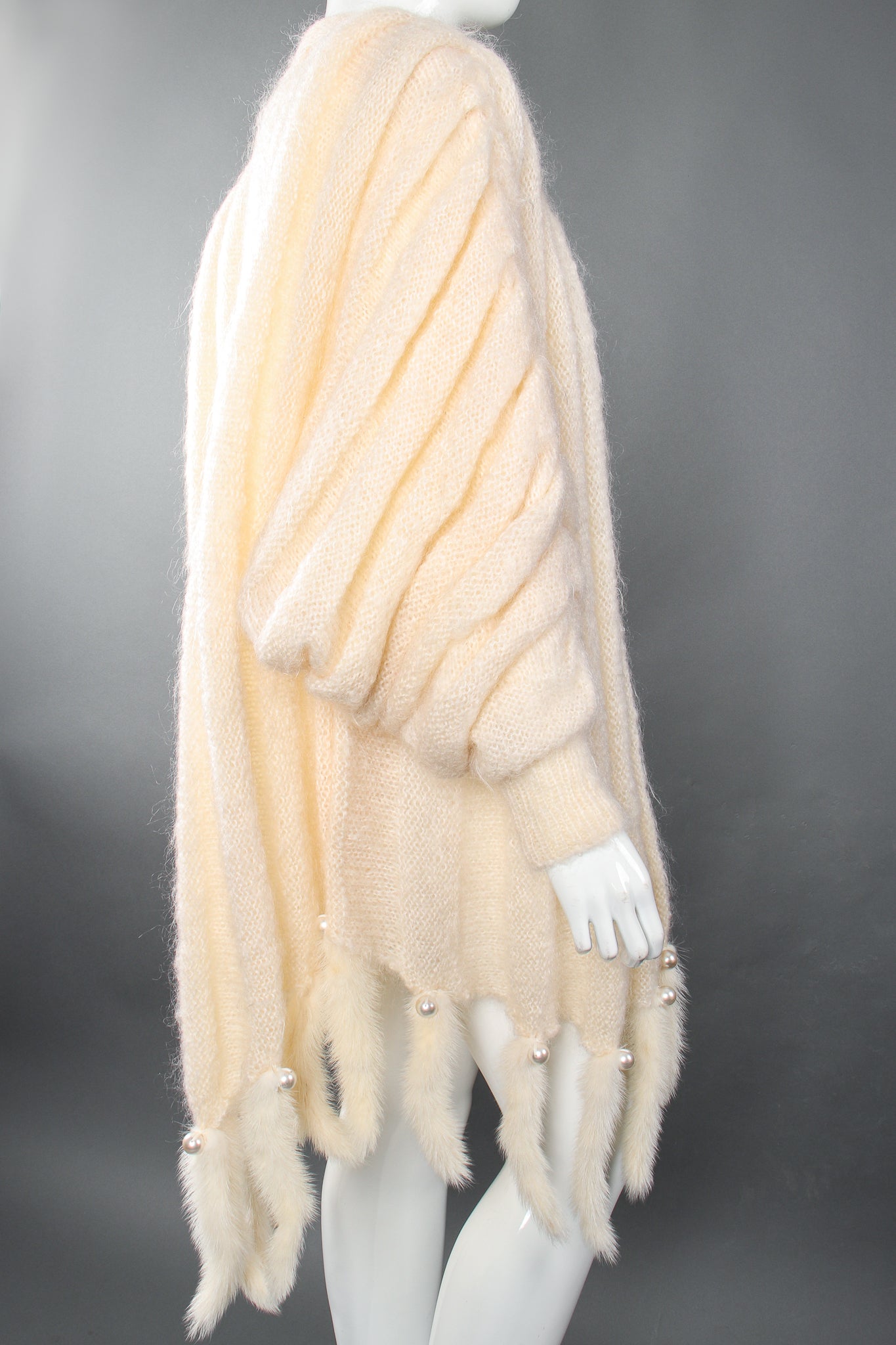 Vintage Nordstrom Fur Trim Batwing Sweater Cape Coat on Mannequin sleeve at Recess Los Angeles
