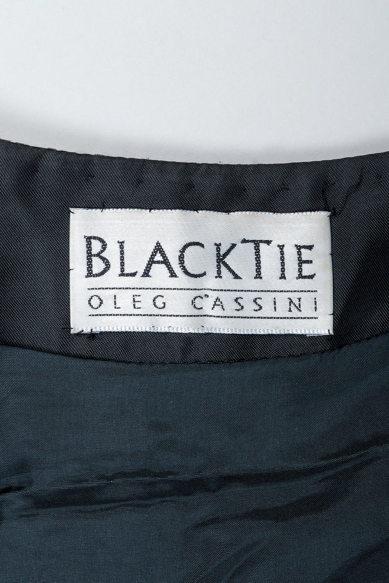 Vintage Oleg Cassini Black Tie Label on black fabric