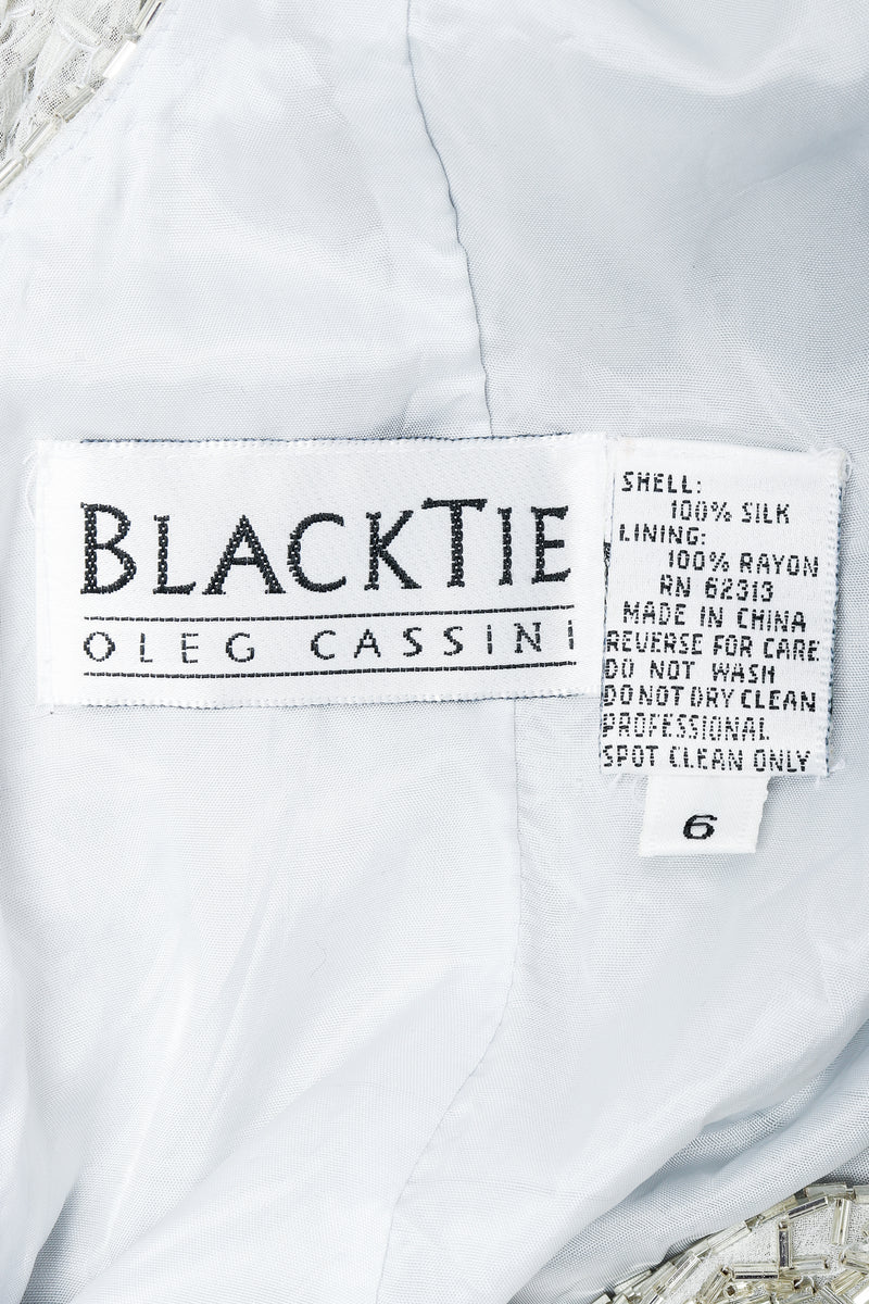 Vintage Oleg Cassini Black Tie Label on white lining fabric