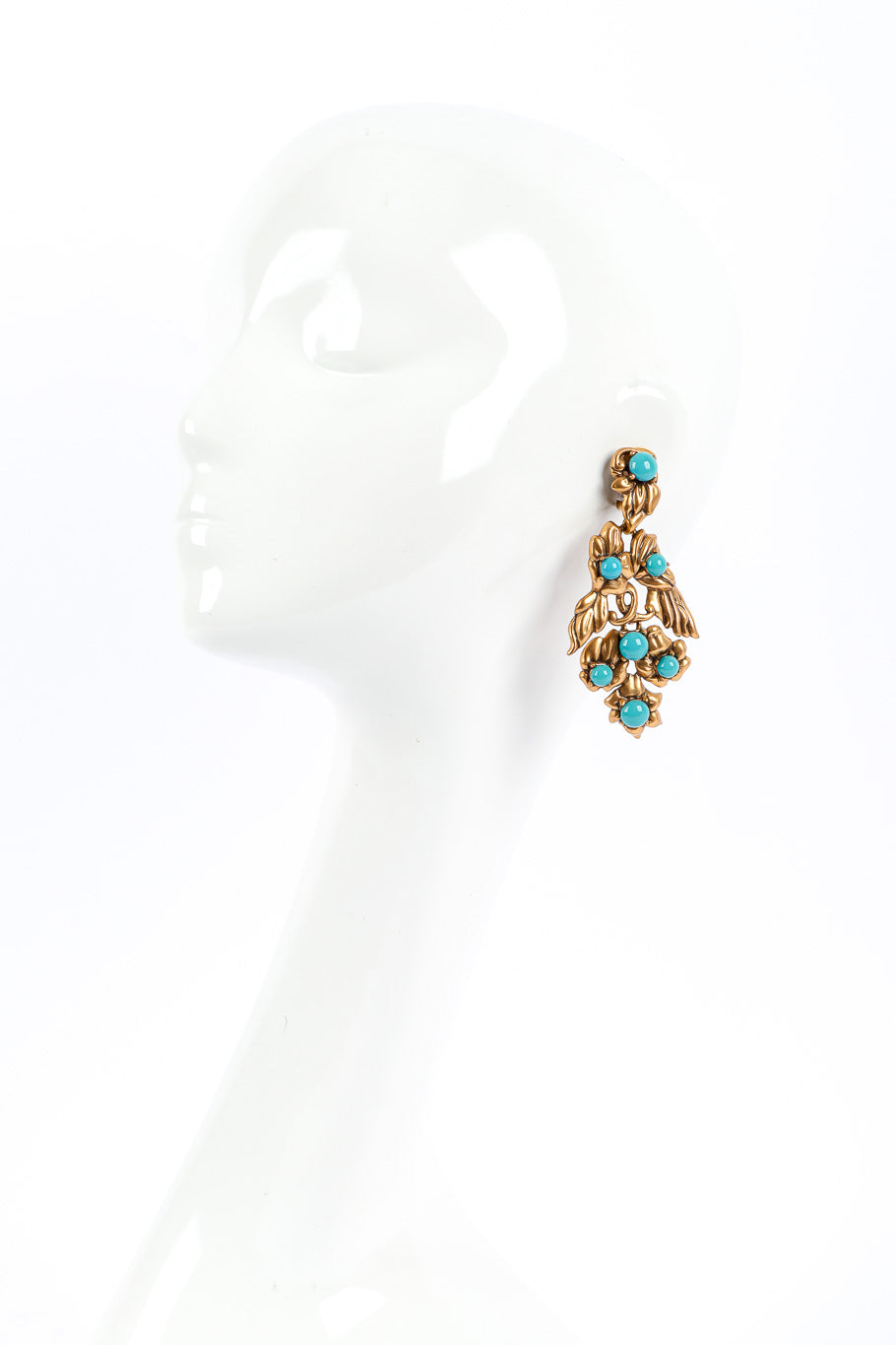 Gold wing earrings by Oscar de la Renta on mannequin @recessla