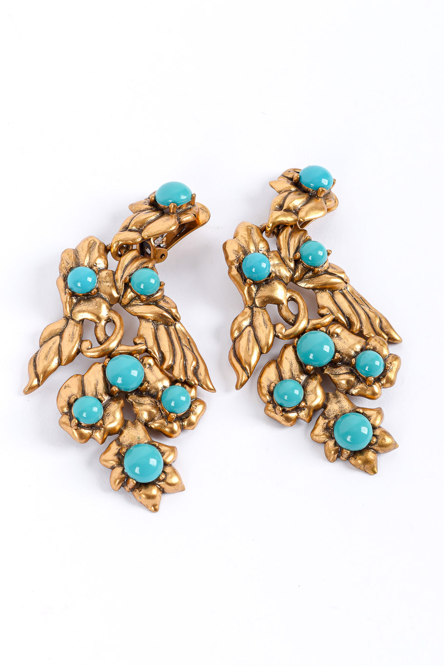 Gold wing earrings by Oscar de la Renta flat lay curved @recessla