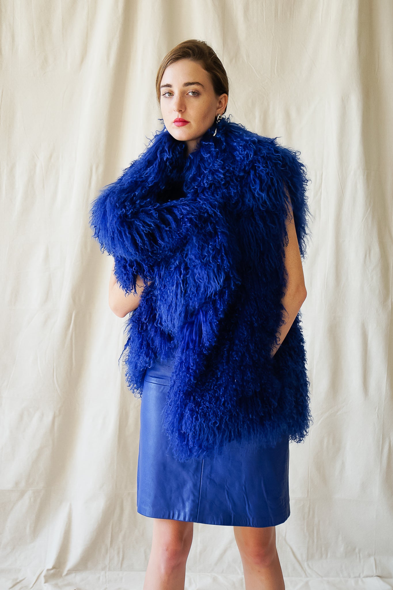 girl in Vintage Marvin Richards blue Mongolian Fur Vest & Climax leather dress @ Recess Los Angeles