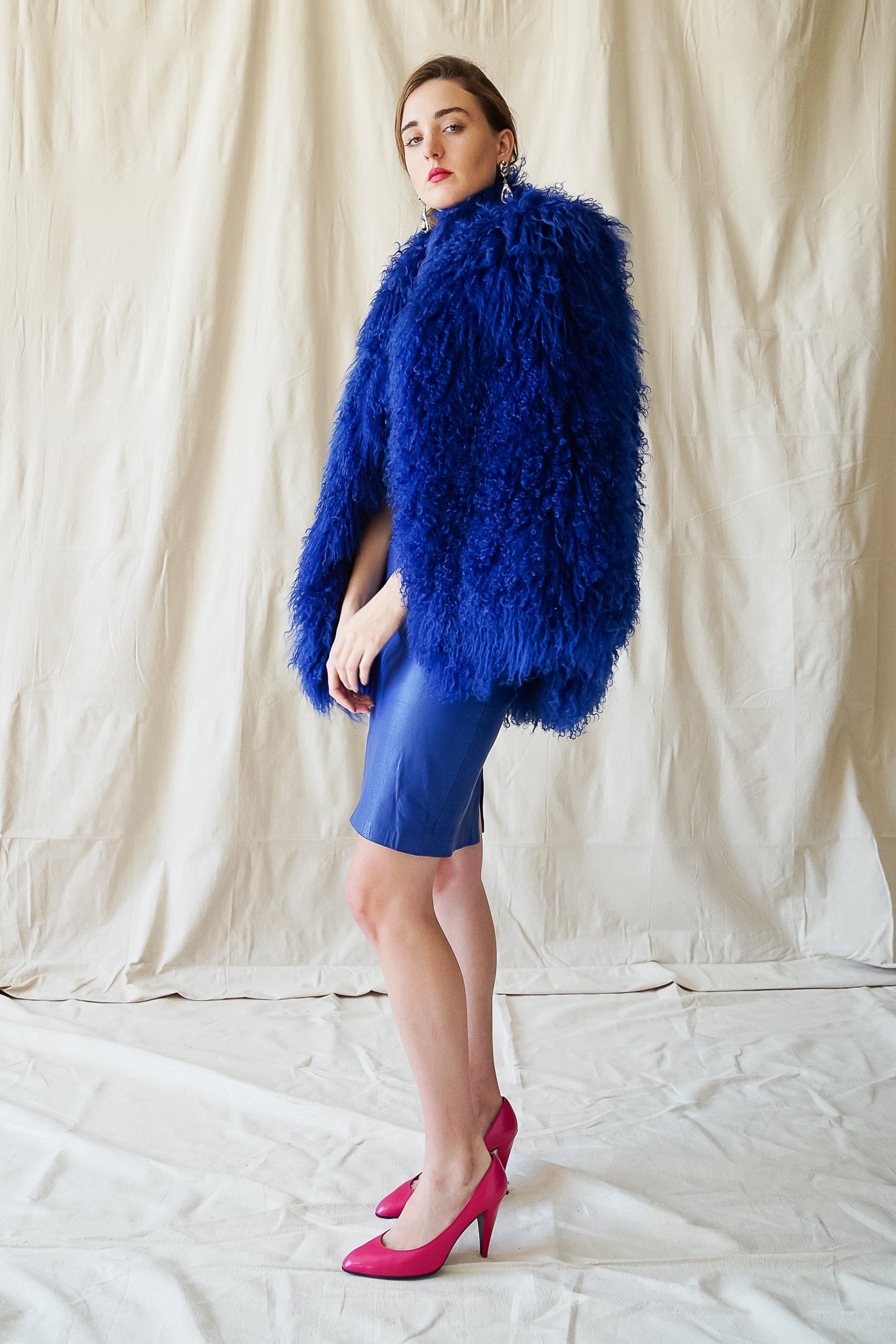 girl in Vintage Marvin Richards blue Mongolian Fur Vest & Climax leather dress @ Recess Los Angeles