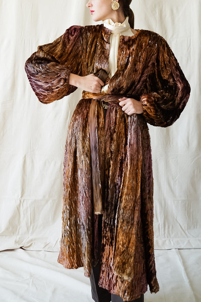Girl in Vintage Diane Freis Plush Silk Tinsel Cape Coat & YSL leather pant at Recess Los Angeles