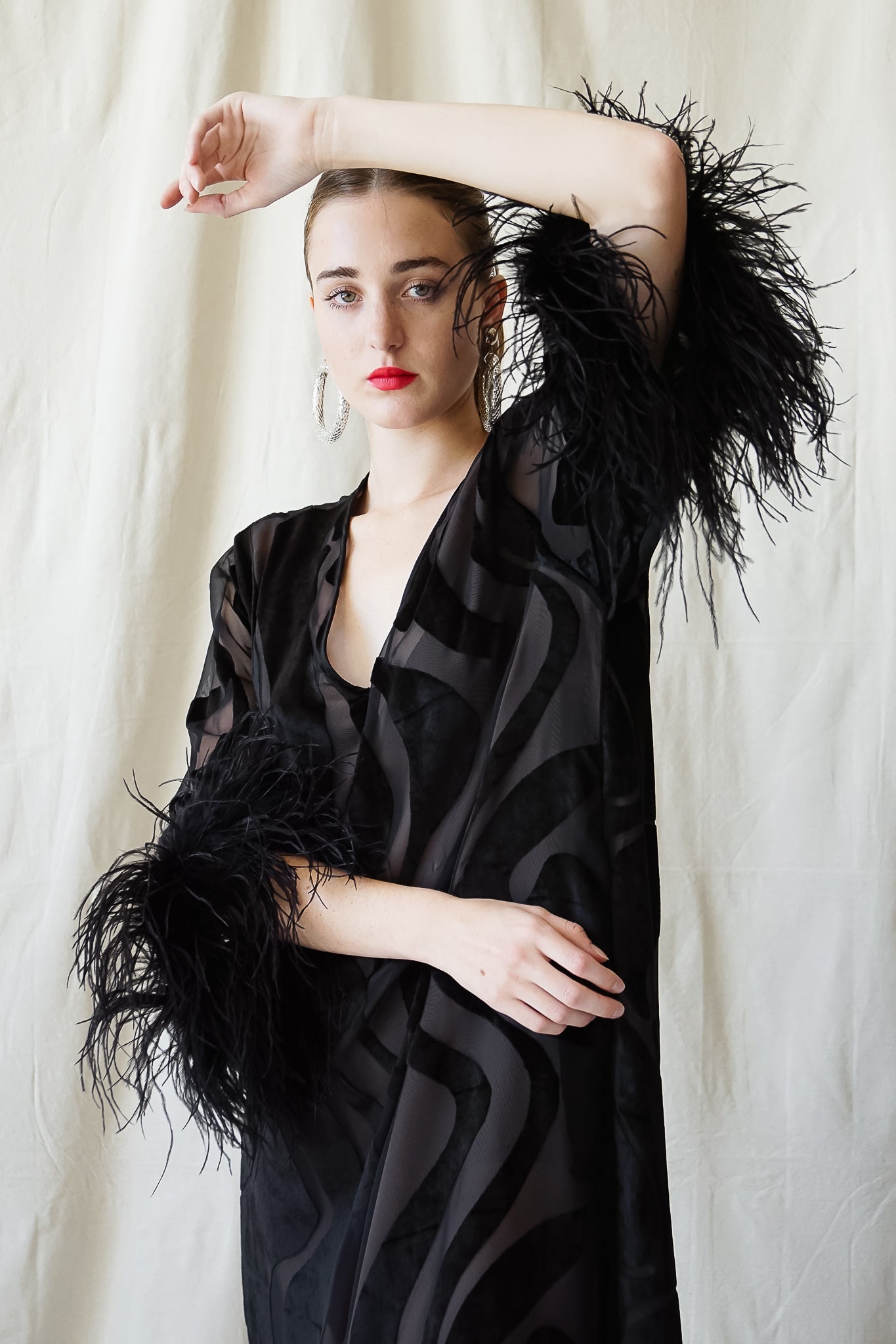 girl in Vintage Valentino Sheer Silk Velvet Burnout Ostrich Trim Caftan Dress at Recess LA