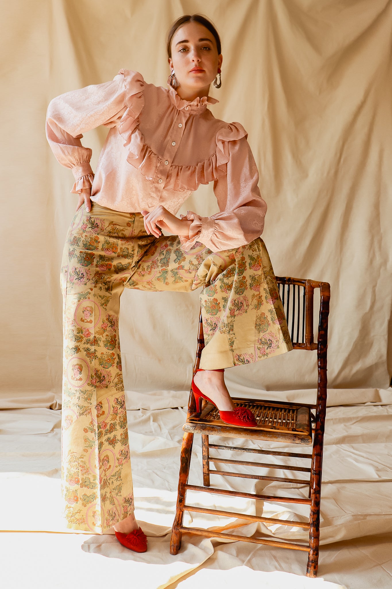 Girl in Vintage Alan Austin Portrait Printed Suede Pant at Recess Los Angeles with chair