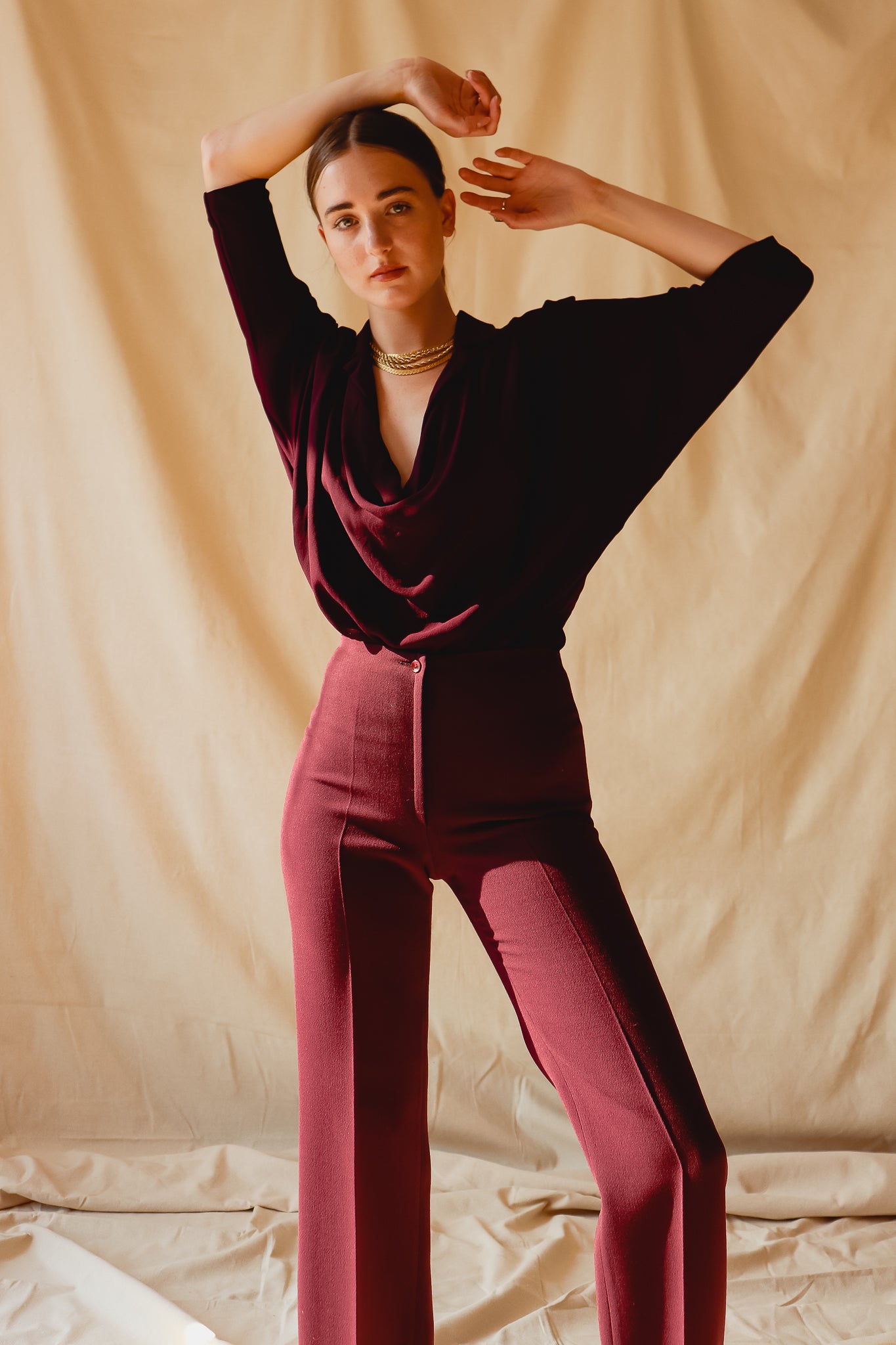 Girl in Vintage Donna Karan Silk Crepe Cowl Bodysuit and plum pant at Recess Los Angeles
