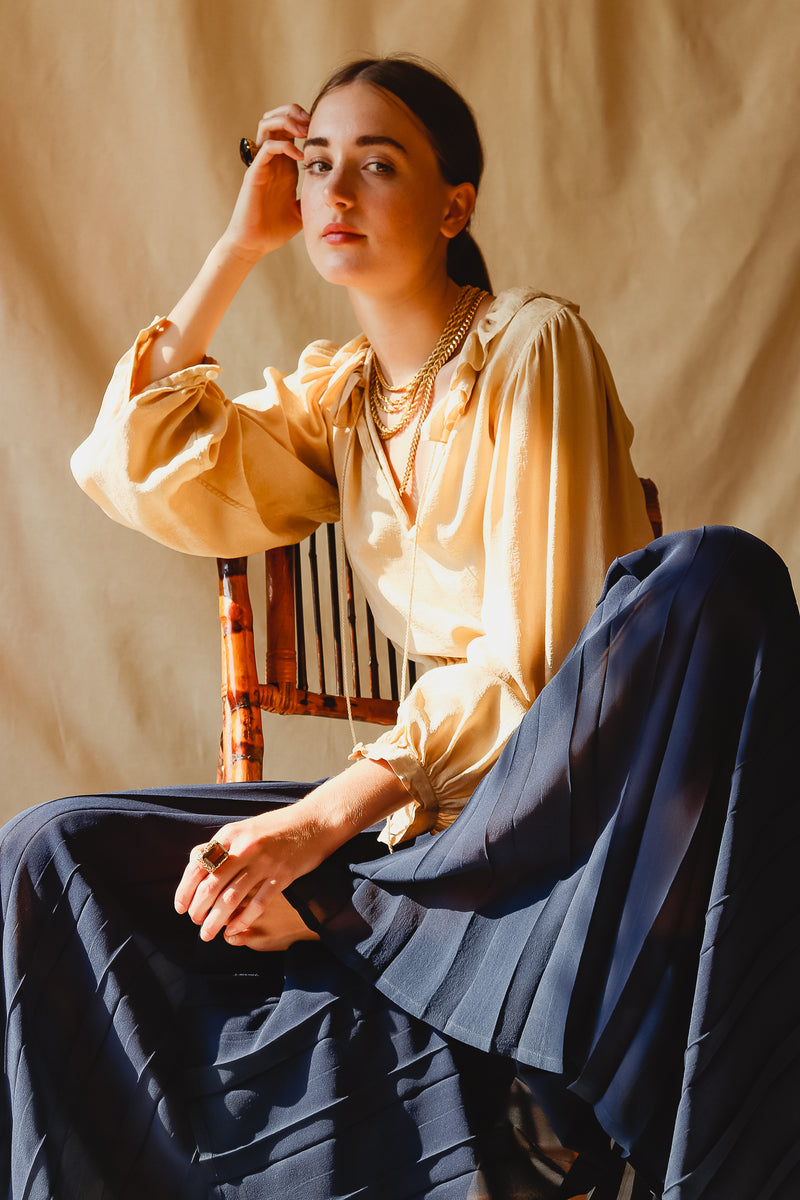 Girl wearing Vintage Yves Saint Laurent YSL Silk Peasant Blouse with sheer palazzo pant at Recess LA