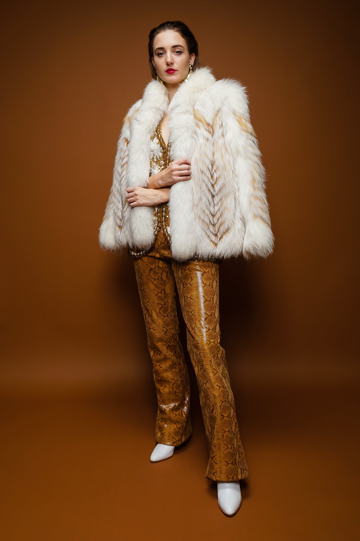girl in Vintage Braude Snakeskin Bootcut Pant and fox fur on brown at Recess Los Angeles