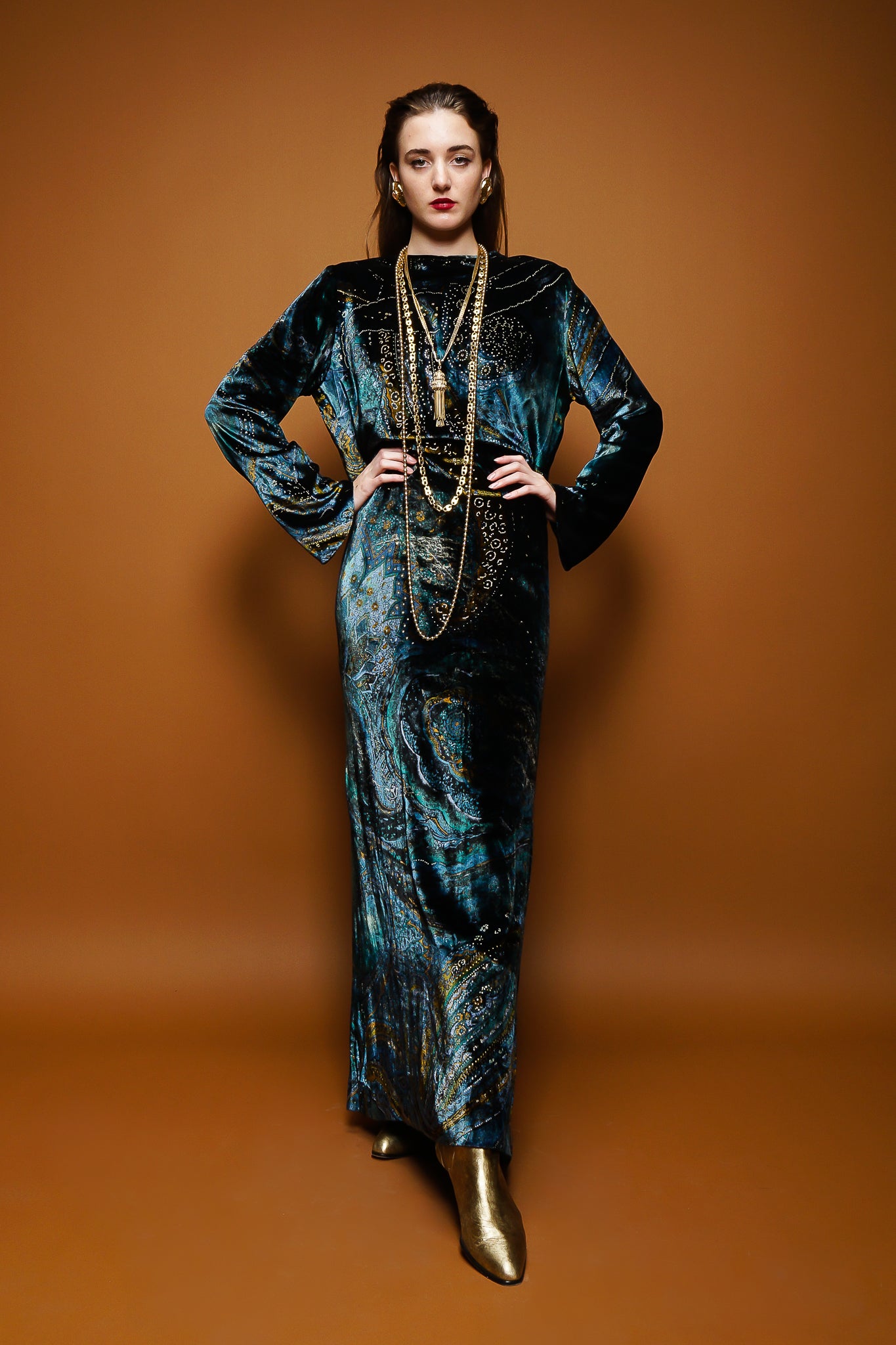 girl in Vintage YSL Yves Saint Laurent Velvet Cosmic Paisley Gown & necklaces on brown at Recess LA