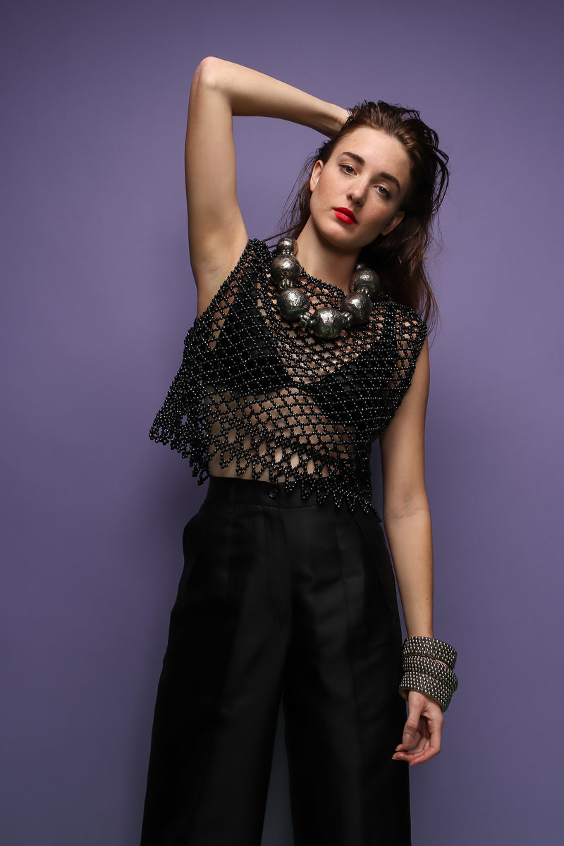 girl in Vintage 60s Bead Mesh Boxy Top & bra on purple background at Recess Los Angeles