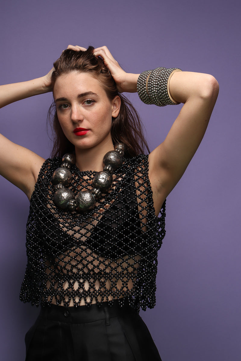 girl in black bead top and Vintage India Hammered Ball Collar Necklace on purple at Recess LA