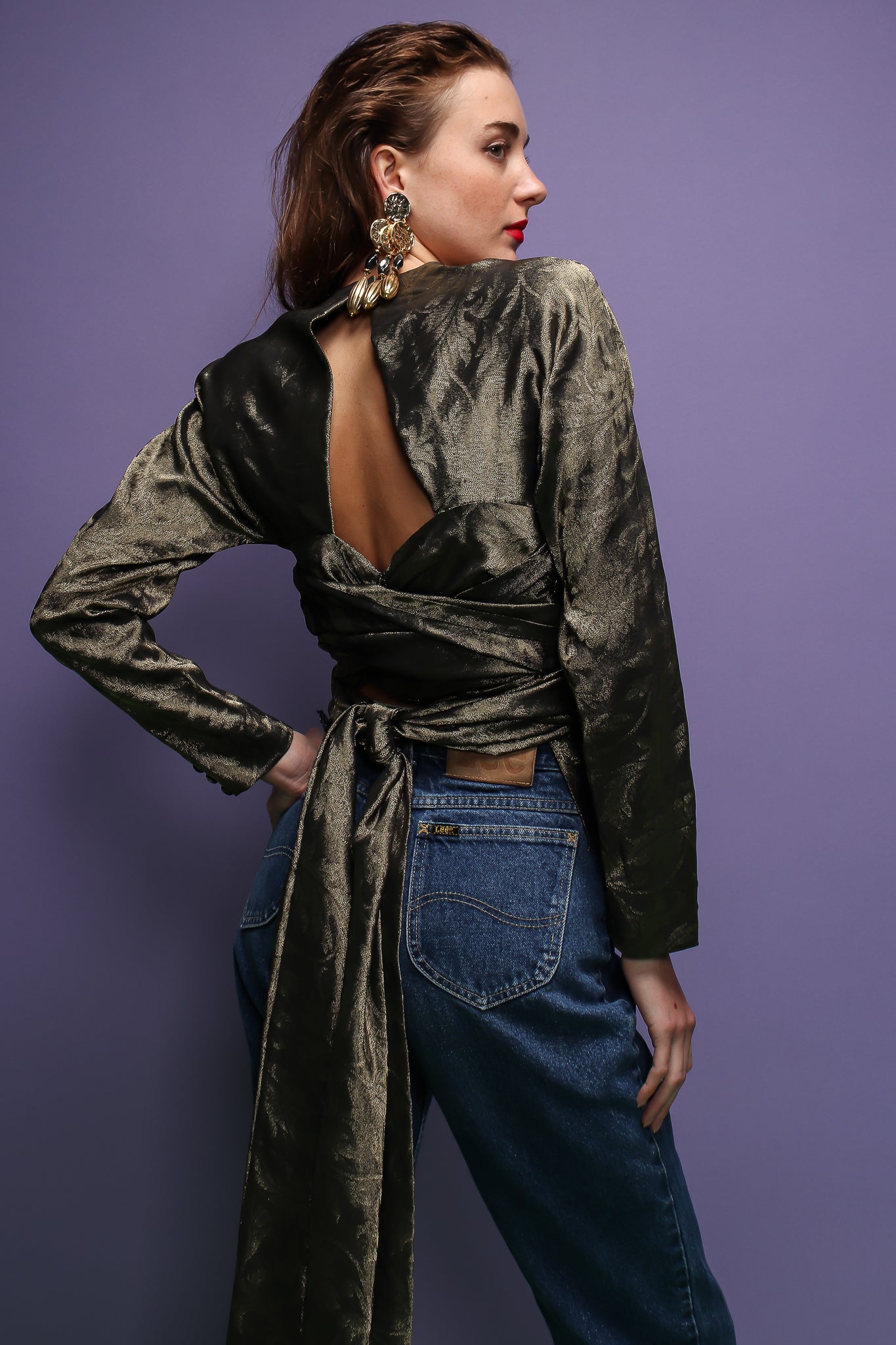 girl in Vintage Carolyne Roehm Metallic Backless Waist Wrap Top on purple background at Recess LA