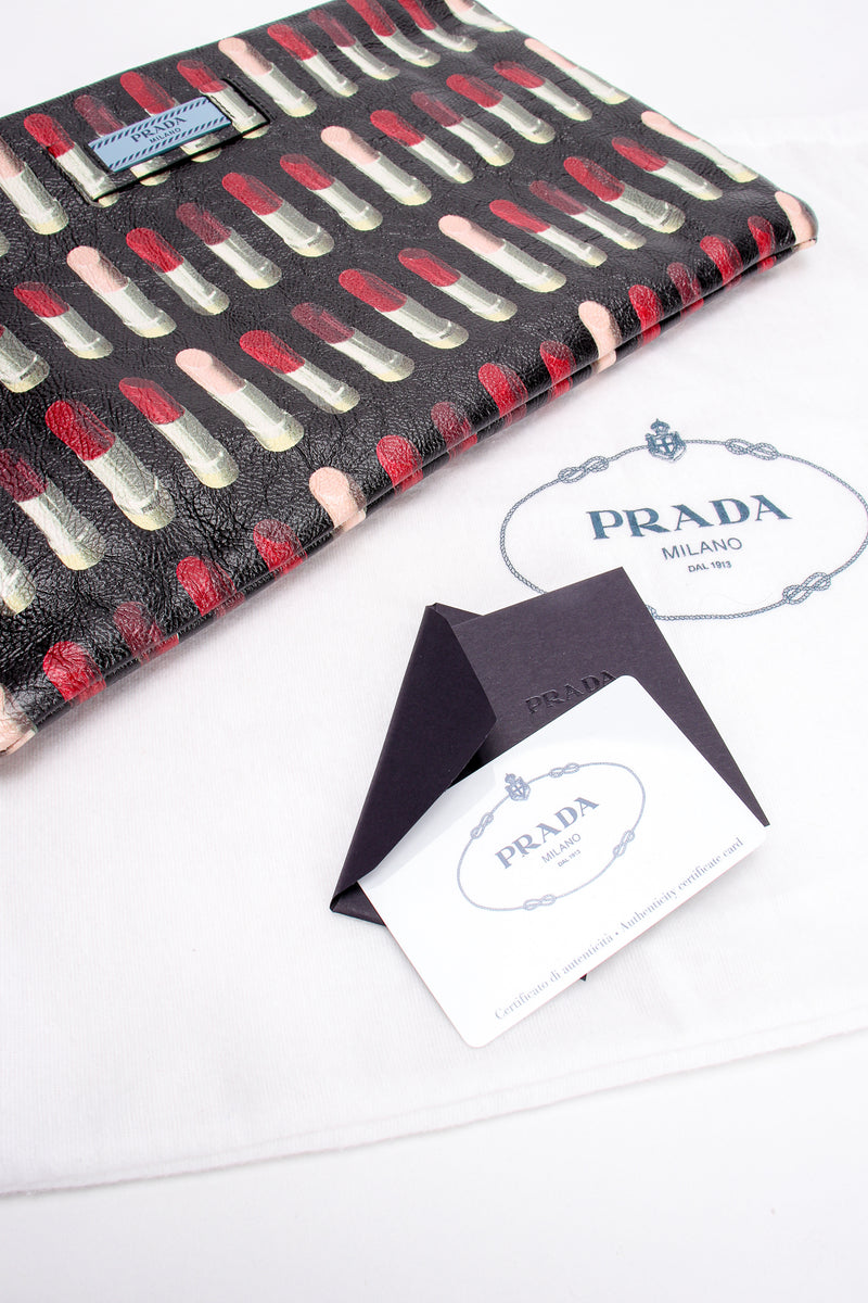 Prada AW 2018 Lipstick Print Leather Convertible Clutch authenticity card at Recess Los Angeles