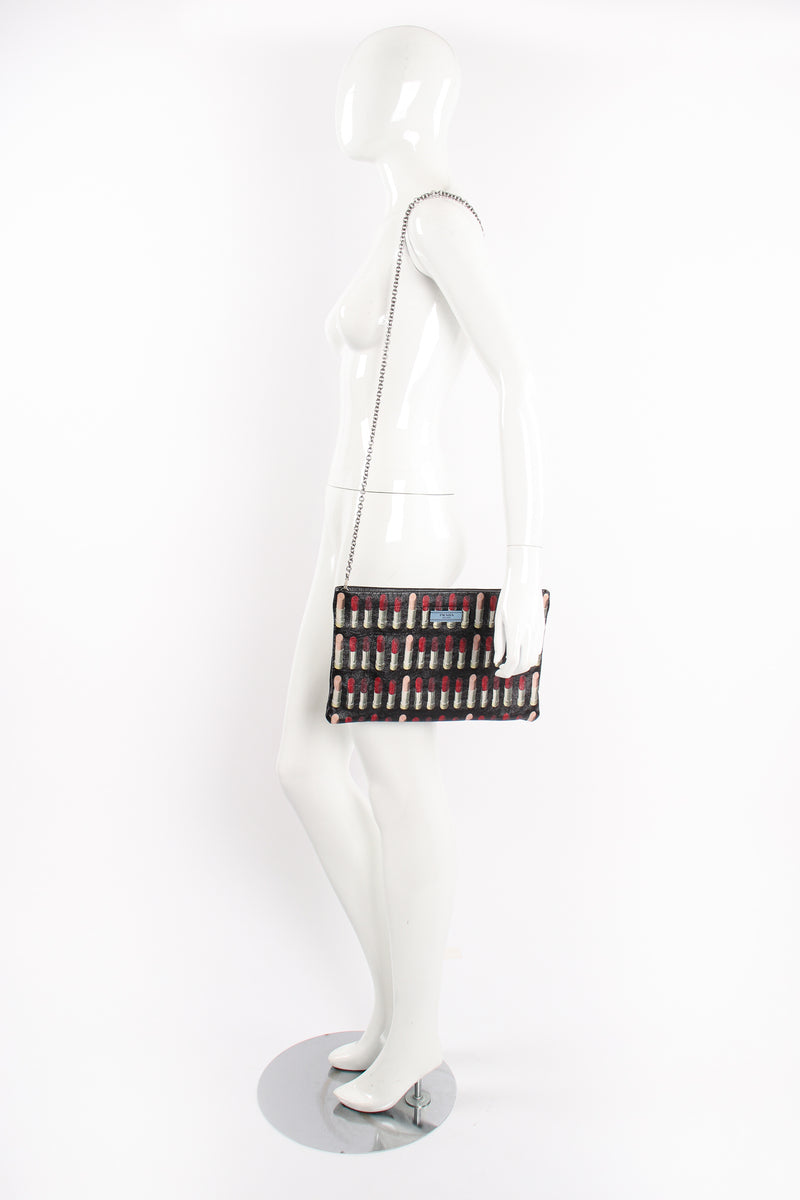 Prada AW 2018 Lipstick Print Leather Convertible Clutch on Mannequin at Recess Los Angeles
