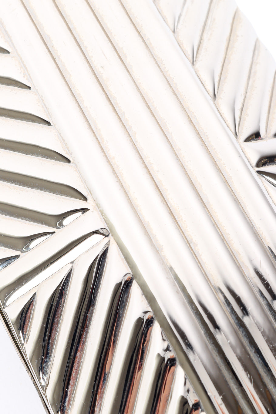 Saks Fifth Avenue metal silver clutch close-up on design @recessla