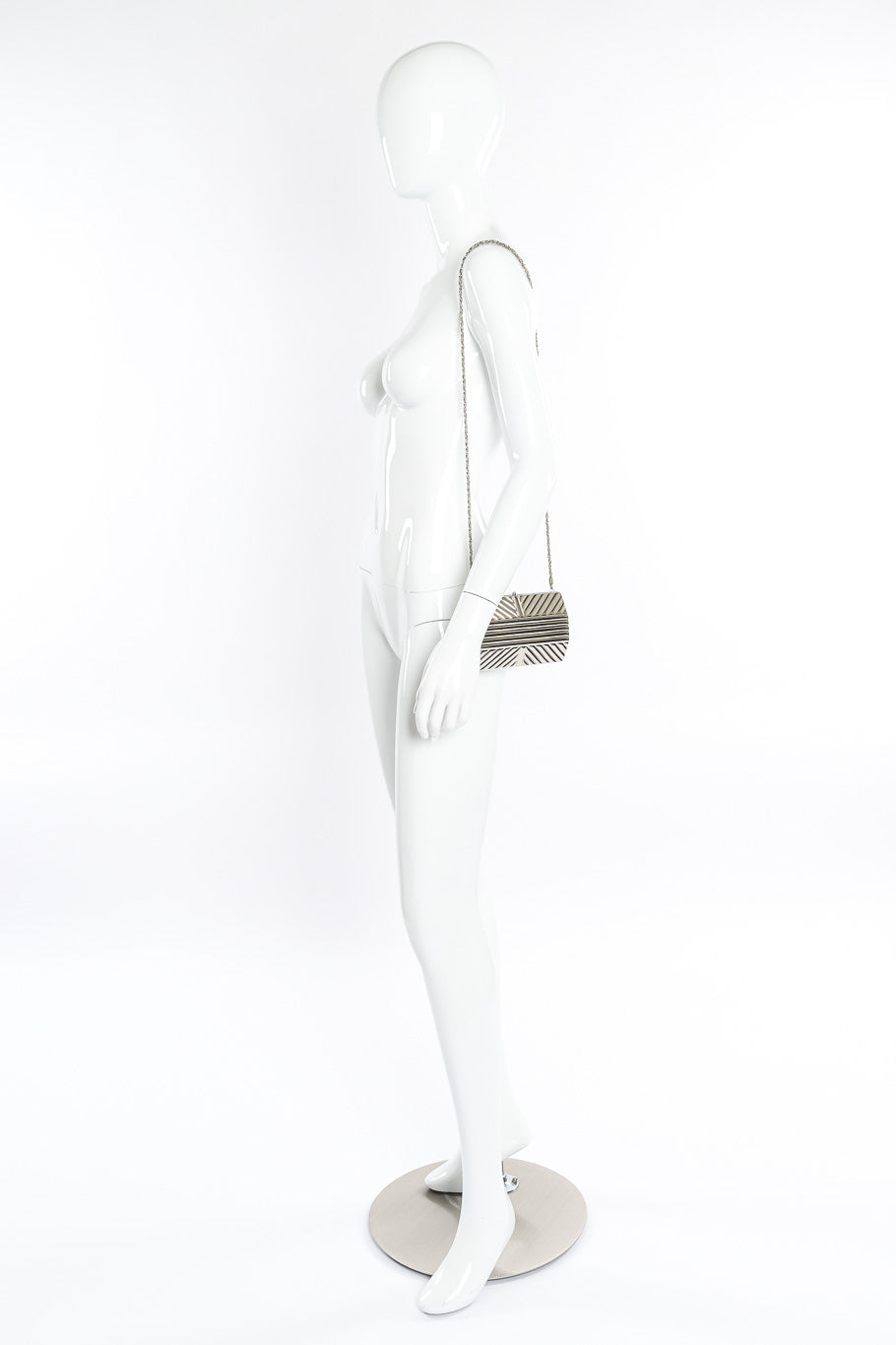 Saks Fifth Avenue metal silver clutch on mannequin @recessla