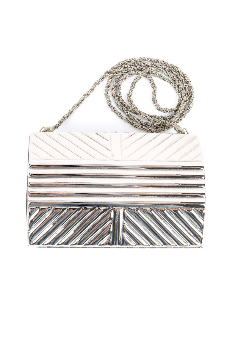 Saks Fifth Avenue metal silver clutch flat-lay product shot @recessla