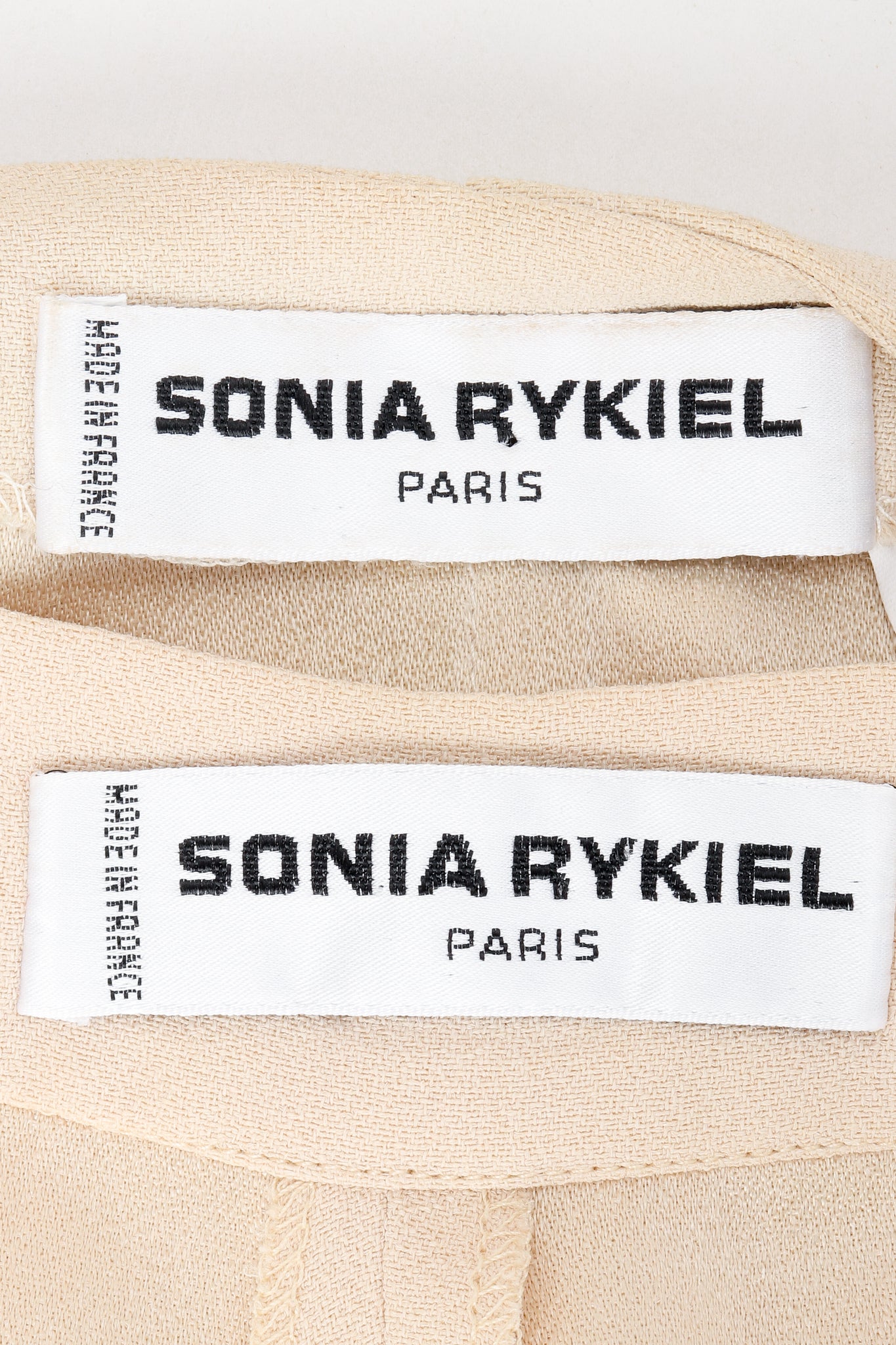 Vintage Sonia Rykiel labels on beige fabric