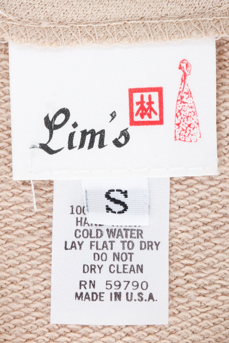 Vintage Lim's label on tank against beige background